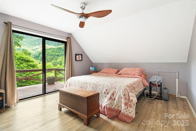 24 Cataloochee Ln, Waynesville, NC 28785 - bedroom featuring access to outside, vaulted ceiling, wood finished floors, and a ceiling fan