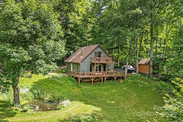 24 Cataloochee Ln, Waynesville, NC 28785 - rear view of property with a wooden deck and a yard