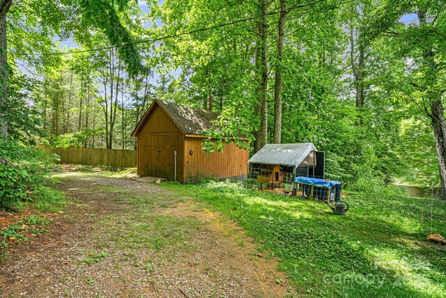 24 Cataloochee Ln, Waynesville, NC 28785 - view of yard featuring exterior structure and an outbuilding