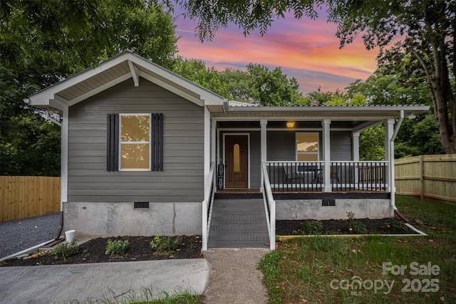 952 Salisbury St, Wadesboro, NC 28170 - view of front of house featuring crawl space, covered porch, and a metal roof