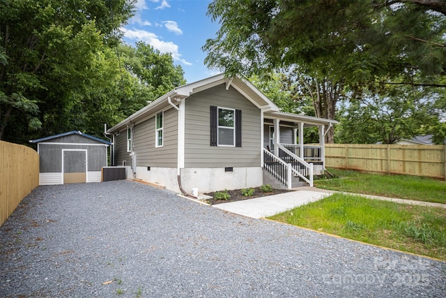 952 Salisbury St, Wadesboro, NC 28170 - bungalow-style house featuring crawl space, covered porch, a storage unit, and driveway