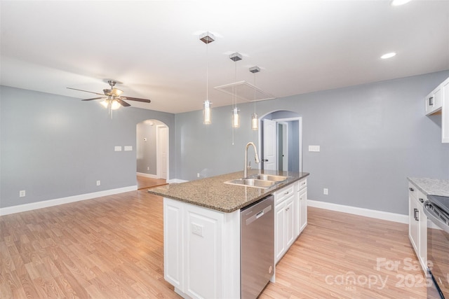 952 Salisbury St, Wadesboro, NC 28170 - kitchen with stainless steel dishwasher, arched walkways, light wood-style flooring, white cabinets, and recessed lighting