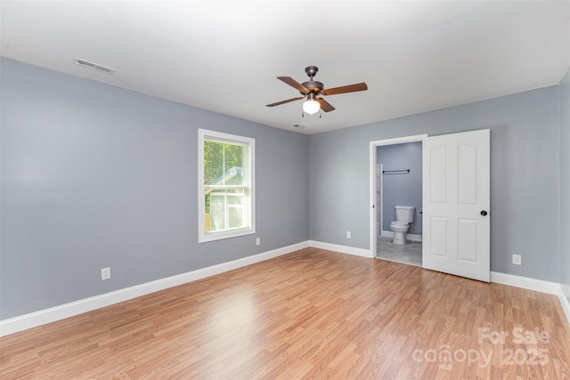 952 Salisbury St, Wadesboro, NC 28170 - unfurnished bedroom with light wood finished floors, ensuite bath, and ceiling fan