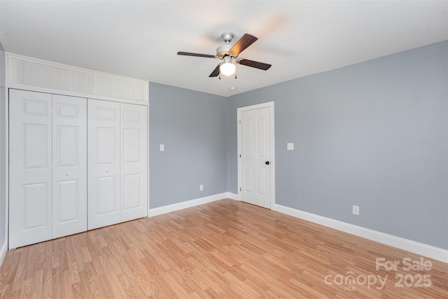 952 Salisbury St, Wadesboro, NC 28170 - unfurnished bedroom with light wood-style flooring, a closet, and ceiling fan