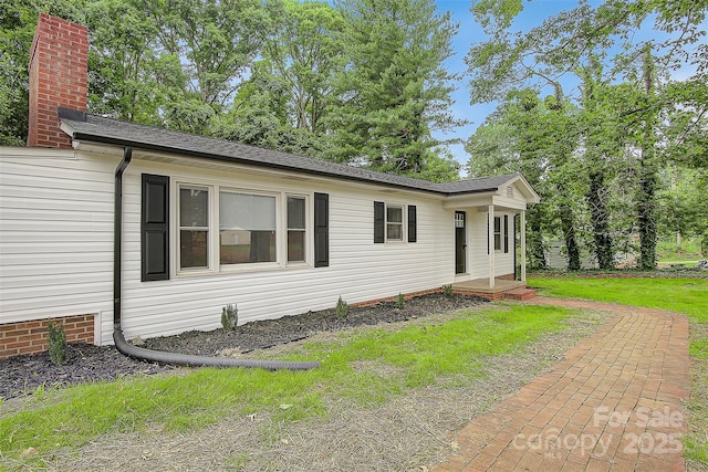 240 Swink Ave, Salisbury, NC 28147 - view of front facade featuring a shingled roof and a chimney