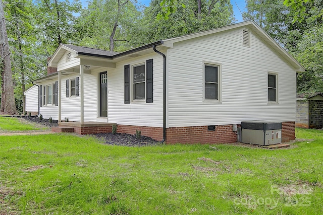 240 Swink Ave, Salisbury, NC 28147 - view of home's exterior featuring central air condition unit, crawl space, and a lawn