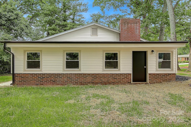 240 Swink Ave, Salisbury, NC 28147 - rear view of property featuring a chimney and brick siding