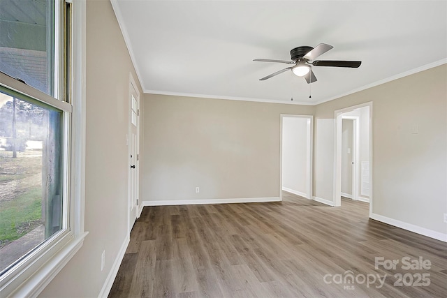 240 Swink Ave, Salisbury, NC 28147 - spare room with ornamental molding, plenty of natural light, wood finished floors, baseboards, and ceiling fan