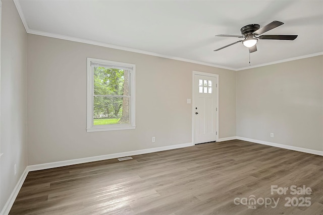 240 Swink Ave, Salisbury, NC 28147 - entryway featuring wood finished floors, a ceiling fan, baseboards, and crown molding