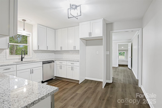 240 Swink Ave, Salisbury, NC 28147 - kitchen featuring dishwasher, a sink, backsplash, dark wood-style flooring, and white cabinets