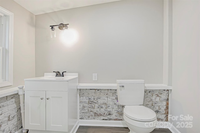240 Swink Ave, Salisbury, NC 28147 - half bathroom featuring vanity, toilet, and wood finished floors