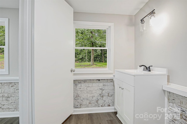 240 Swink Ave, Salisbury, NC 28147 - bathroom with healthy amount of natural light, wood finished floors, vanity, and baseboards