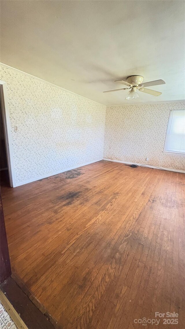 1073 Springdale Dr, Maiden, NC 28650 - spare room with wallpapered walls, hardwood / wood-style flooring, and ceiling fan
