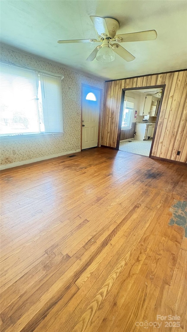 1073 Springdale Dr, Maiden, NC 28650 - unfurnished living room with wood-type flooring, a ceiling fan, and healthy amount of natural light