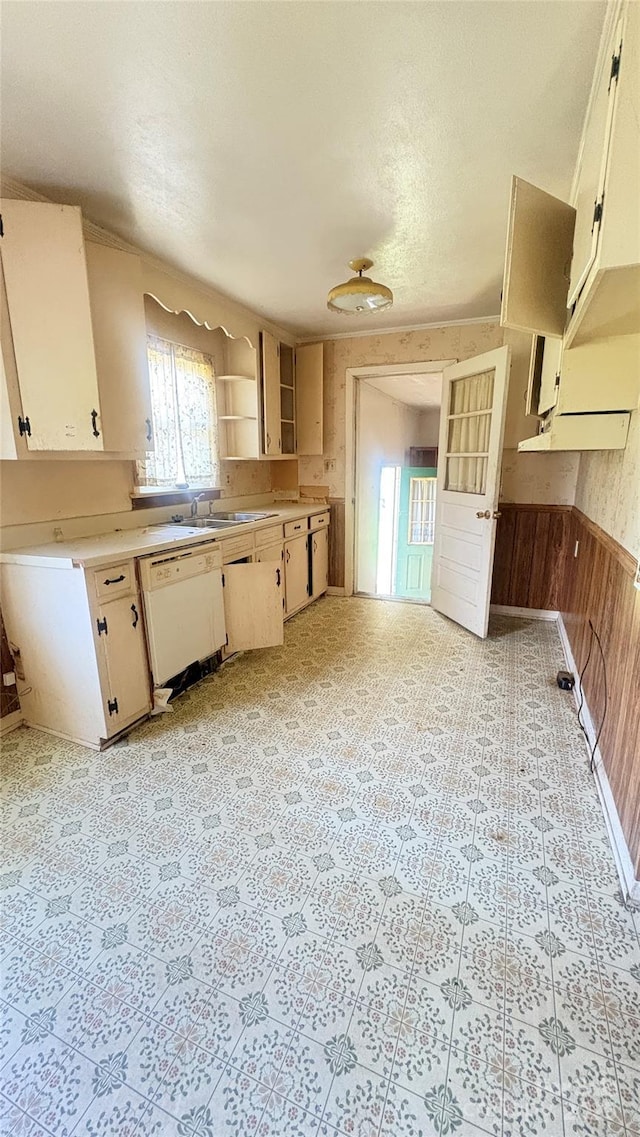 1073 Springdale Dr, Maiden, NC 28650 - kitchen with white dishwasher, open shelves, light countertops, wood walls, and a wainscoted wall