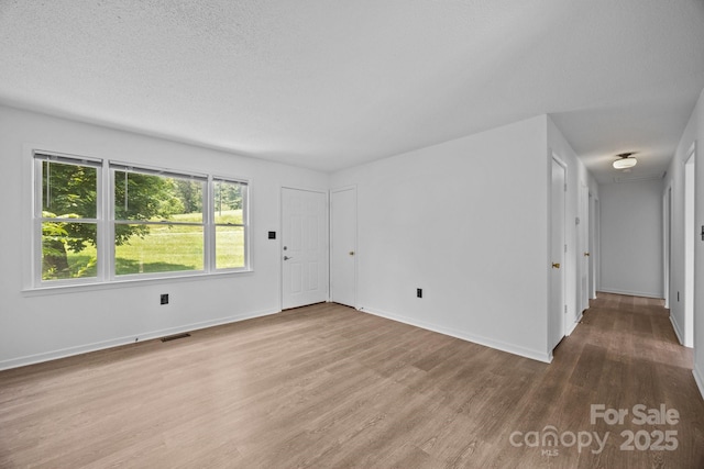 520 Forest St, Mars Hill, NC 28754 - spare room with wood finished floors and baseboards