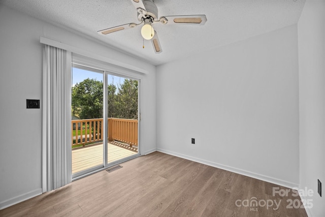 520 Forest St, Mars Hill, NC 28754 - spare room featuring wood finished floors, ceiling fan, baseboards, and a textured ceiling