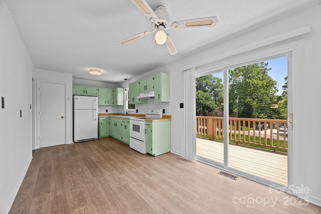 520 Forest St, Mars Hill, NC 28754 - kitchen featuring white appliances, green cabinetry, under cabinet range hood, light wood-style flooring, and a sink