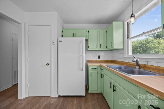 520 Forest St, Mars Hill, NC 28754 - kitchen featuring freestanding refrigerator, a sink, green cabinets, and dark wood-style flooring