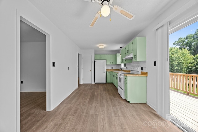 520 Forest St, Mars Hill, NC 28754 - kitchen with green cabinets, white appliances, light wood-style floors, under cabinet range hood, and a ceiling fan