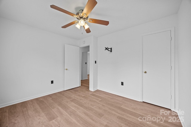 520 Forest St, Mars Hill, NC 28754 - unfurnished bedroom with light wood-type flooring, baseboards, and a ceiling fan