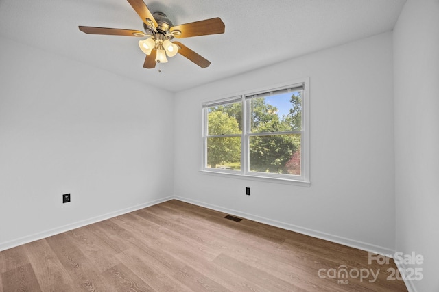 520 Forest St, Mars Hill, NC 28754 - unfurnished room featuring wood finished floors, baseboards, and a ceiling fan