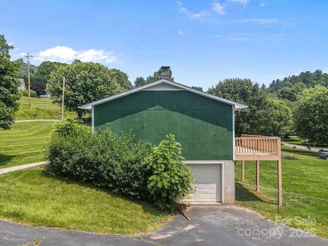 520 Forest St, Mars Hill, NC 28754 - view of side of home featuring a lawn, a wooden deck, and a chimney
