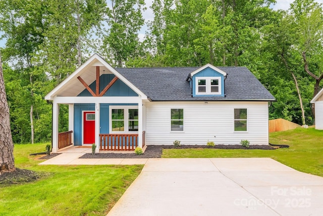 516 N Mulberry St, Cherryville, NC 28021 - view of front of home with a porch, roof with shingles, a front yard, and board and batten siding