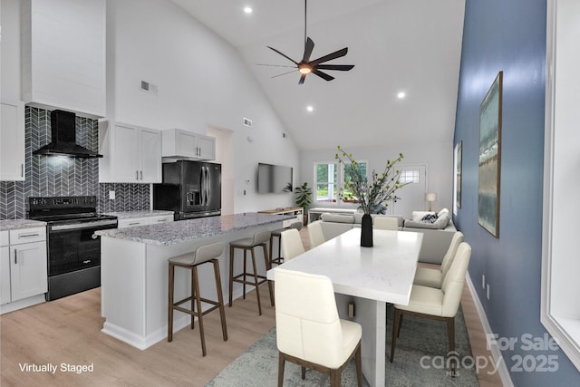 516 N Mulberry St, Cherryville, NC 28021 - dining space with high vaulted ceiling, ceiling fan, light wood-type flooring, and recessed lighting