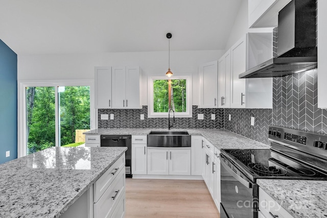 516 N Mulberry St, Cherryville, NC 28021 - kitchen with stainless steel range with electric cooktop, black dishwasher, wall chimney range hood, and white cabinetry