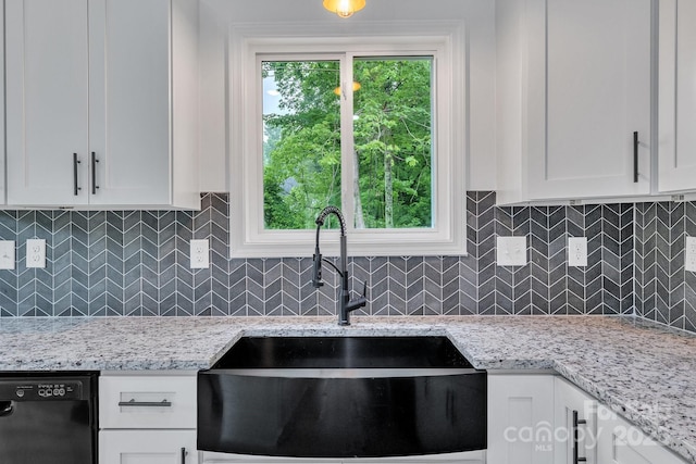 516 N Mulberry St, Cherryville, NC 28021 - kitchen with black dishwasher, white cabinetry, light stone counters, and decorative backsplash