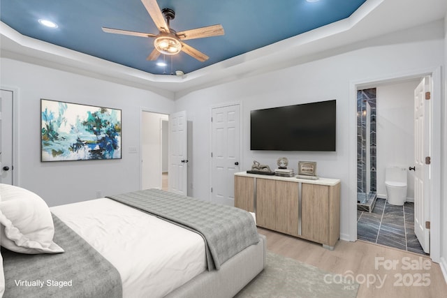 516 N Mulberry St, Cherryville, NC 28021 - bedroom featuring a raised ceiling, recessed lighting, light wood-style floors, ensuite bathroom, and a ceiling fan