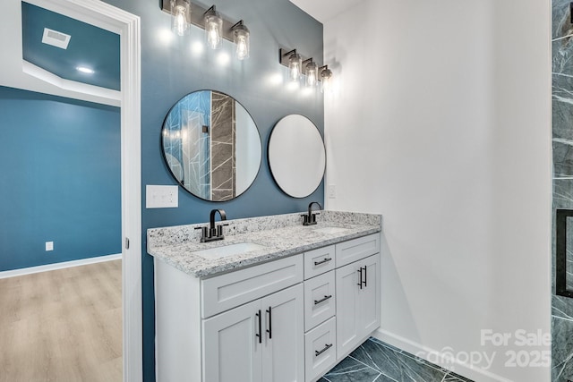 516 N Mulberry St, Cherryville, NC 28021 - full bathroom with double vanity and baseboards