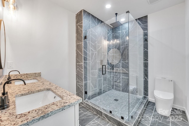 516 N Mulberry St, Cherryville, NC 28021 - bathroom with double vanity, marble finish floors, a shower stall, and recessed lighting