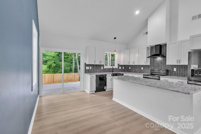 516 N Mulberry St, Cherryville, NC 28021 - kitchen with stainless steel electric stove, dishwasher, wall chimney range hood, a kitchen island, and backsplash