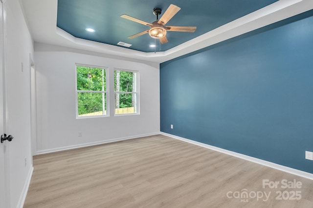 516 N Mulberry St, Cherryville, NC 28021 - empty room featuring a ceiling fan, a raised ceiling, wood finished floors, and recessed lighting