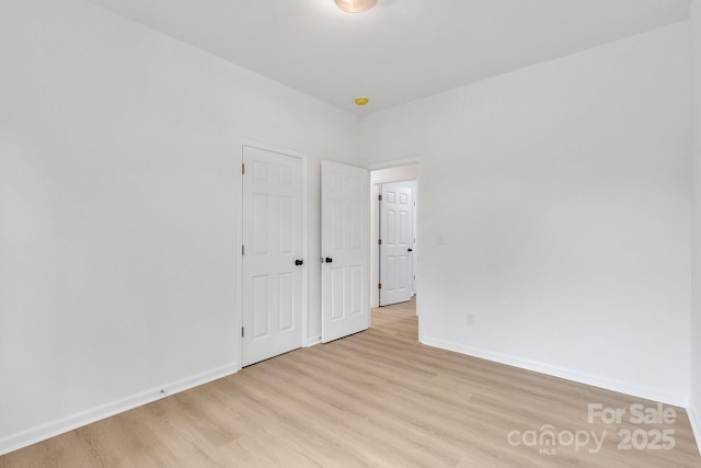 516 N Mulberry St, Cherryville, NC 28021 - unfurnished bedroom featuring light wood-style floors and baseboards