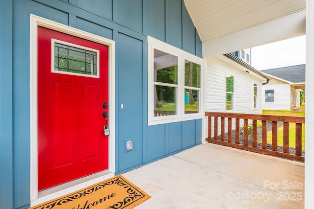 516 N Mulberry St, Cherryville, NC 28021 - doorway to property featuring board and batten siding and covered porch