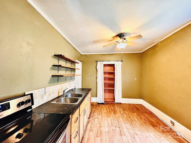 602 Brookshire St, Asheville, NC 28803 - kitchen featuring electric range, a sink, dark countertops, light wood-type flooring, and a ceiling fan