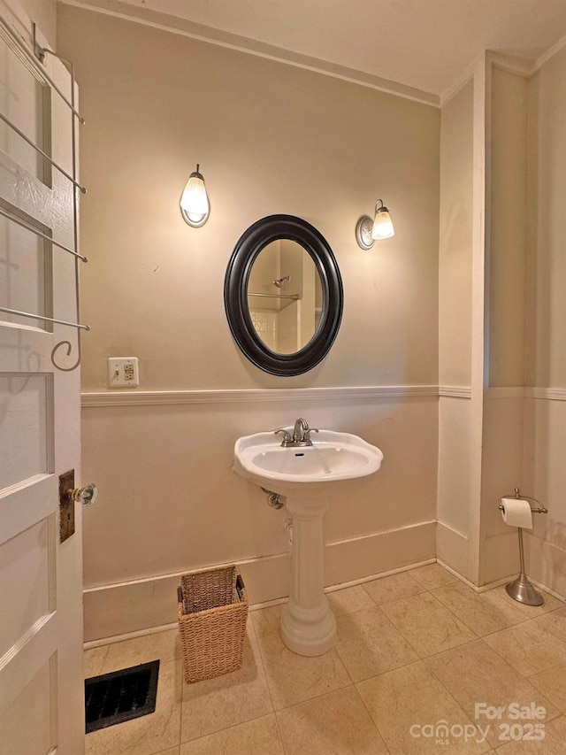 602 Brookshire St, Asheville, NC 28803 - bathroom featuring tile patterned flooring, baseboards, and ornamental molding