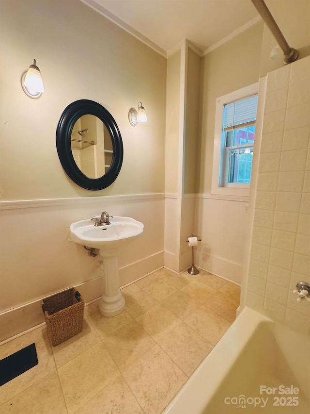602 Brookshire St, Asheville, NC 28803 - full bathroom with tile patterned floors, crown molding, shower / tub combination, and baseboards