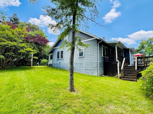 602 Brookshire St, Asheville, NC 28803 - view of side of home featuring a lawn, a wooden deck, stairs, and a chimney