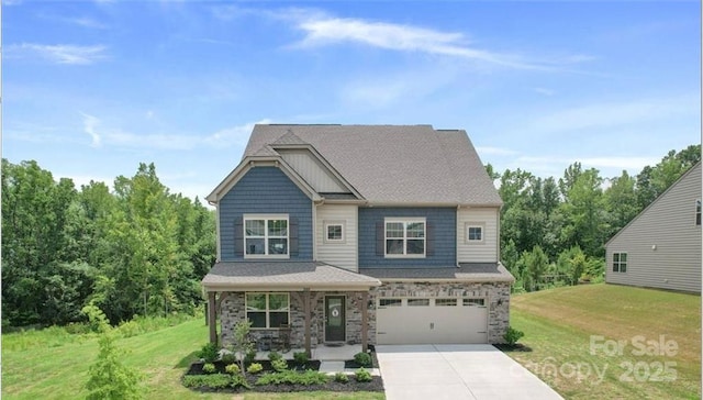 2009 Trindle Vine Ln, Waxhaw, NC 28173 - craftsman house featuring a porch, driveway, a front yard, a garage, and stone siding