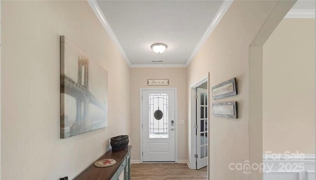2009 Trindle Vine Ln, Waxhaw, NC 28173 - foyer entrance featuring crown molding, wood finished floors, and baseboards