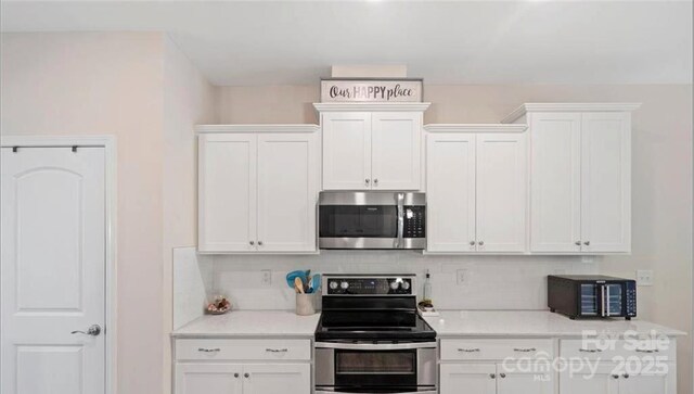2009 Trindle Vine Ln, Waxhaw, NC 28173 - kitchen featuring appliances with stainless steel finishes, white cabinets, and backsplash