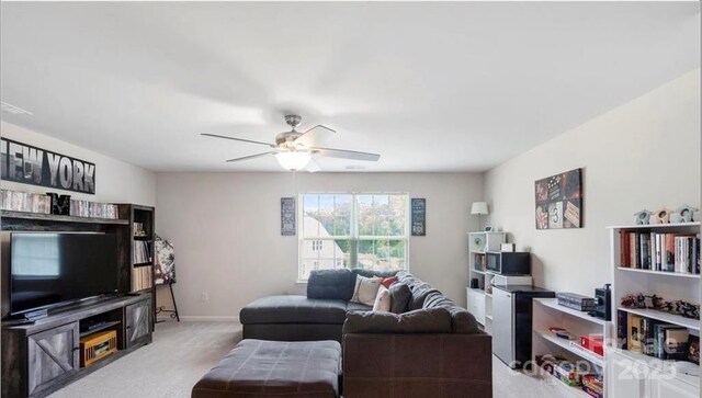 2009 Trindle Vine Ln, Waxhaw, NC 28173 - living room with carpet floors, a ceiling fan, and baseboards