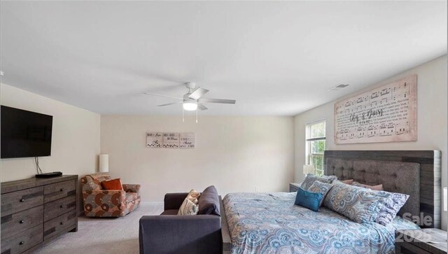 2009 Trindle Vine Ln, Waxhaw, NC 28173 - bedroom featuring a fireplace, carpet floors, and a ceiling fan