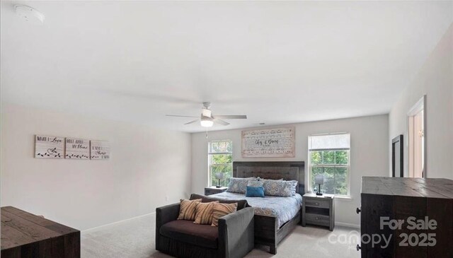 2009 Trindle Vine Ln, Waxhaw, NC 28173 - bedroom with light colored carpet, baseboards, and ceiling fan
