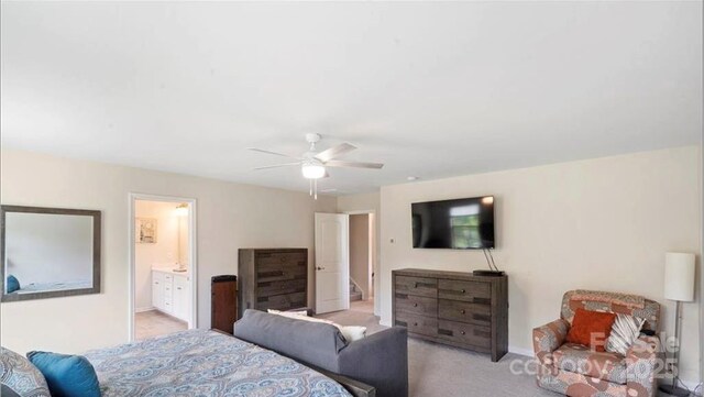 2009 Trindle Vine Ln, Waxhaw, NC 28173 - carpeted bedroom featuring baseboards, ceiling fan, and connected bathroom