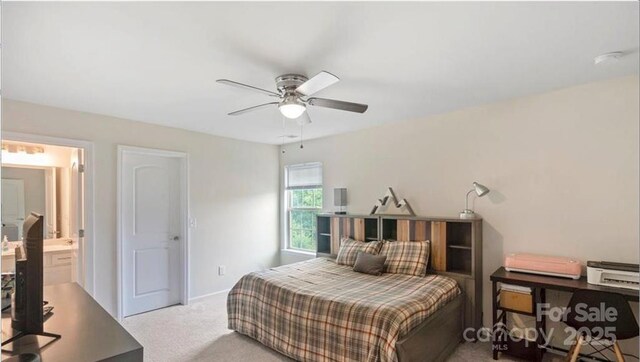 2009 Trindle Vine Ln, Waxhaw, NC 28173 - carpeted bedroom with ensuite bath, a ceiling fan, and baseboards